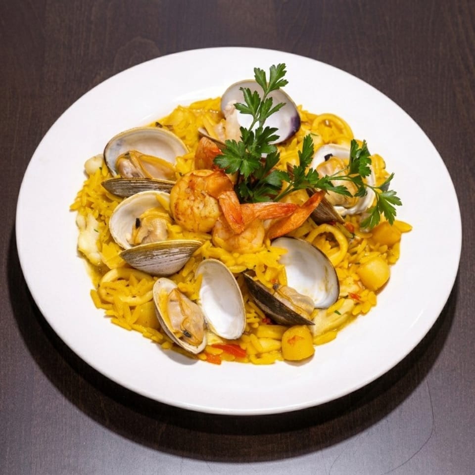 A vibrant seafood paella with shrimp, clams, and squid, garnished with fresh parsley on a white plate.